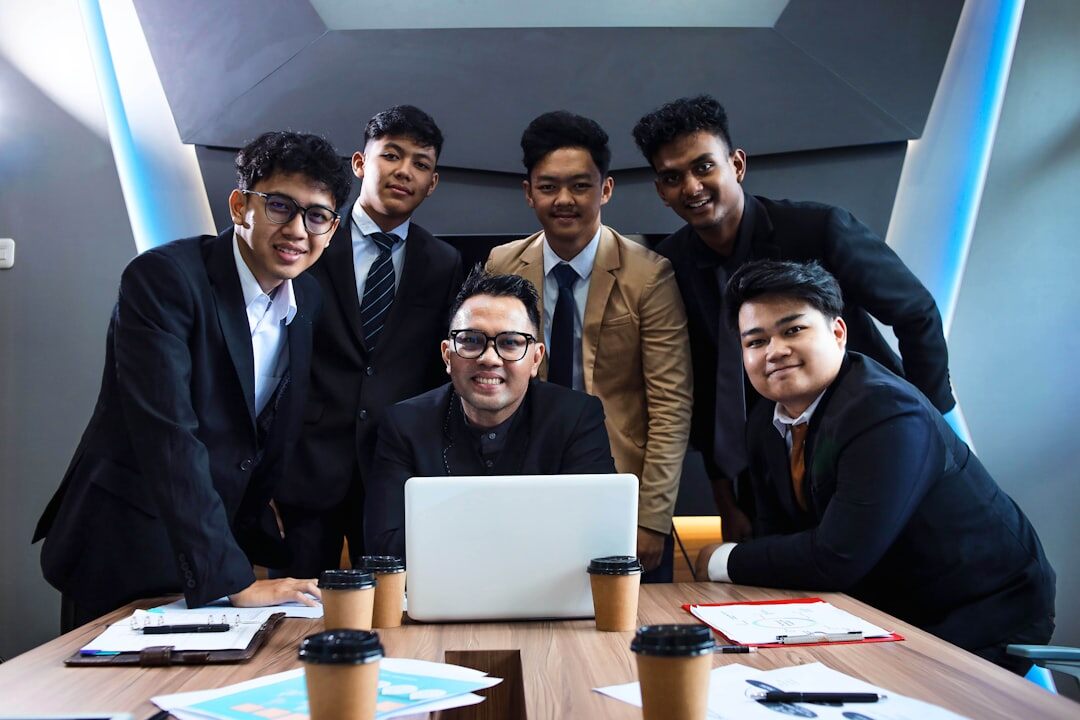 Diverse team of business professionals smiling together