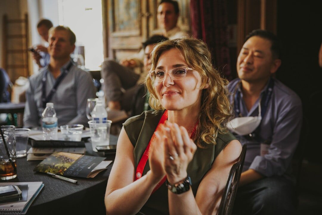 Businesswoman presenting to an audience at a summit