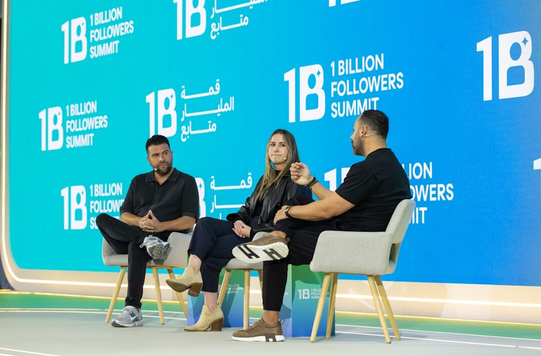 Two women discussing during a panel session at a business summit